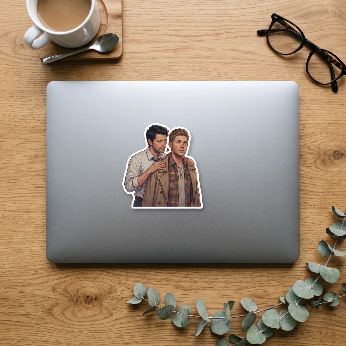 Castiel drapes his iconic trench coat over Dean's shoulders to keep him warm and safe., view 2